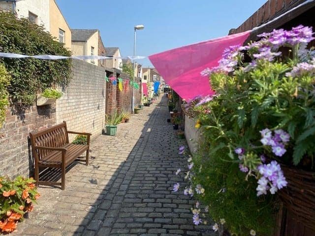 Neighbours in Litherland transform their overgrown alleyway into an amazing community garden