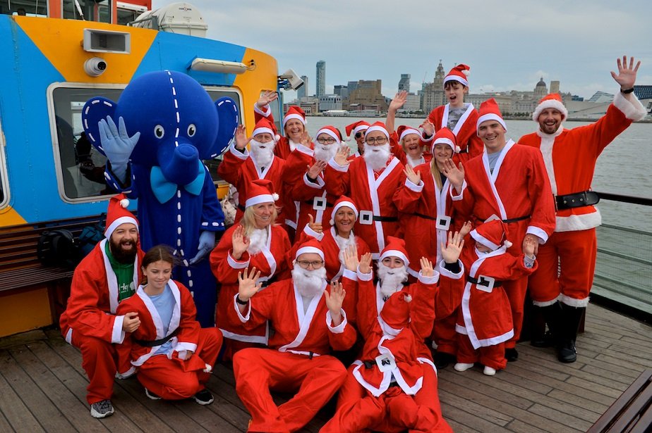 City Santas take Ferry across the Mersey to mark countdown to Liverpool Santa Dash